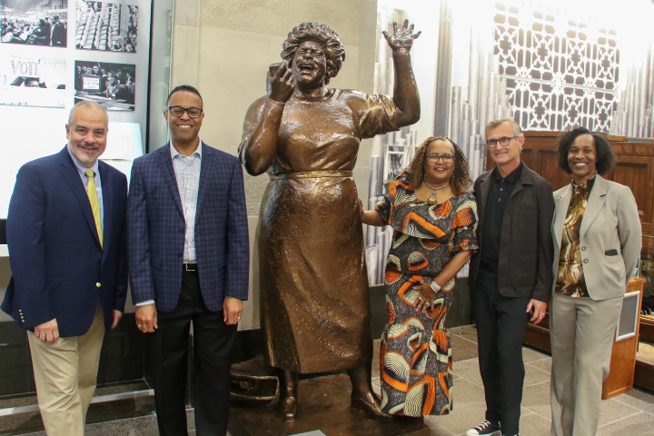 People gathered around statue