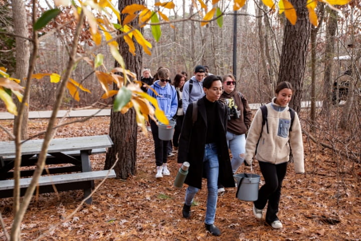 students walking at lake