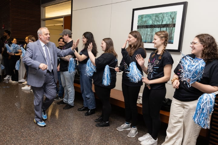 President Joe Bertolino celebrates with students 