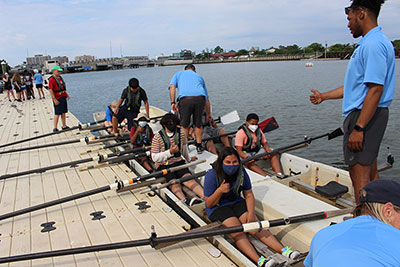 rowing camp participants in the water