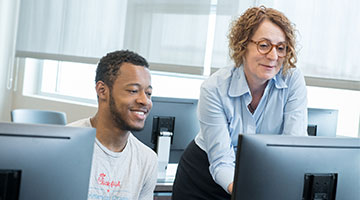 A Stockton instructor assisting a student