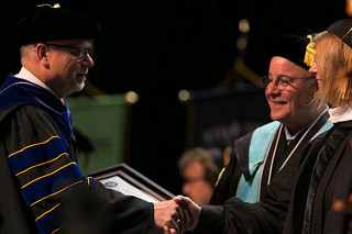 Dr. Carr shaking hands with Dr. Kesselman