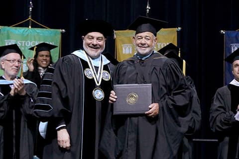 award being presented at Commencement