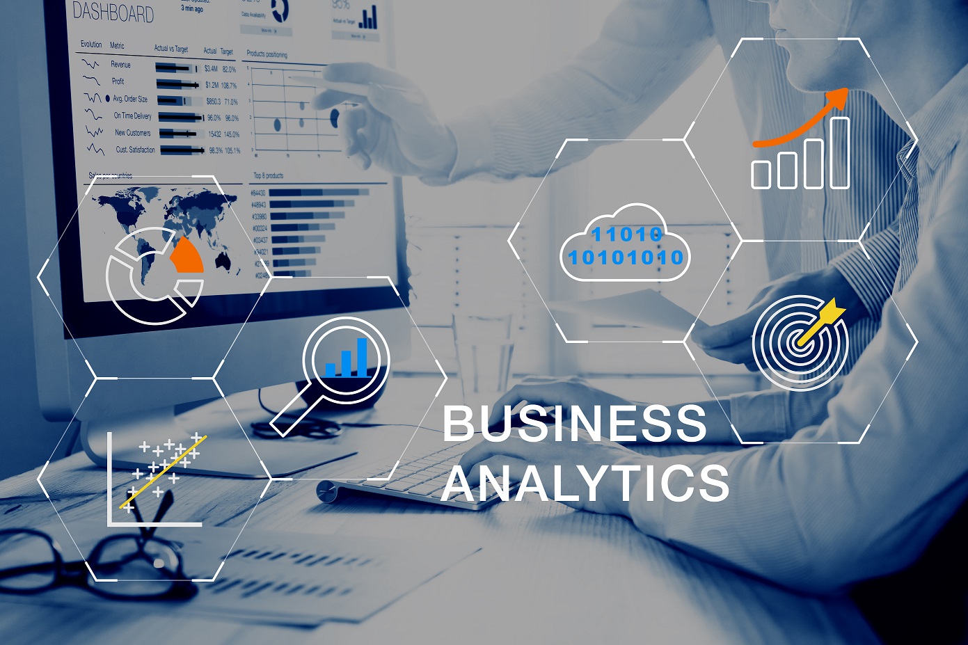 Blurry man on computer in background with Business Analytics graphs