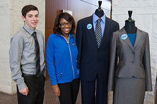 students standing beside suits