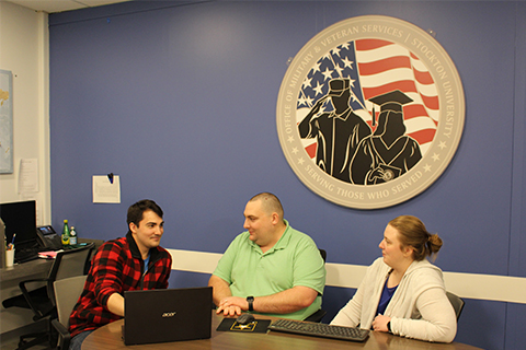 From left, first-year History major Richard Belmont, of Absecon, works in Stockton’s Military and Veterans Success Center with Director Michael Barany and Assistant Director Ashley Jones. The center is located on Stockton’s Galloway campus.