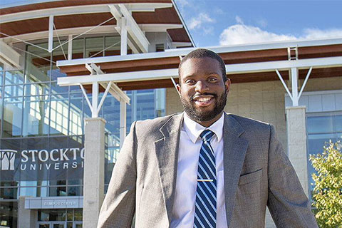 Ike Ejikeme in front of the Campus Center
