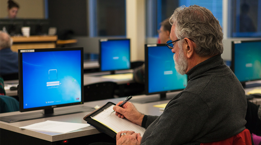 Older man in front of a computer.