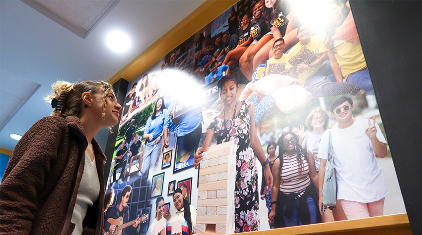 Yesenia Pacheco, coordinator for Student Transition, Access and Retention, wrote about the December 2023 unveiling of the Stockton Faces hallway mural in the academic spine. Photos by Lizzie Nealis. 