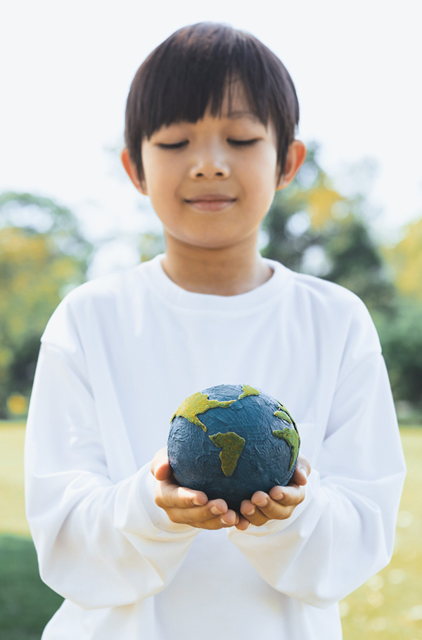 Kid holding globe
