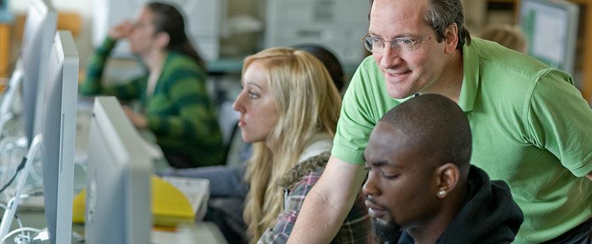 Students learning in a computer lab