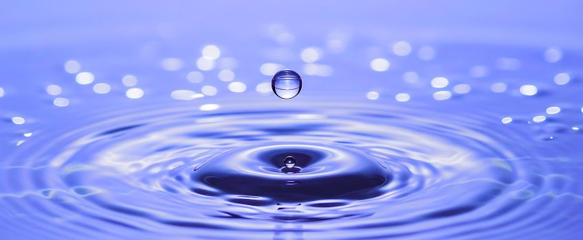 drop of water creating ripples in a pool drop of water creating ripples in a pool