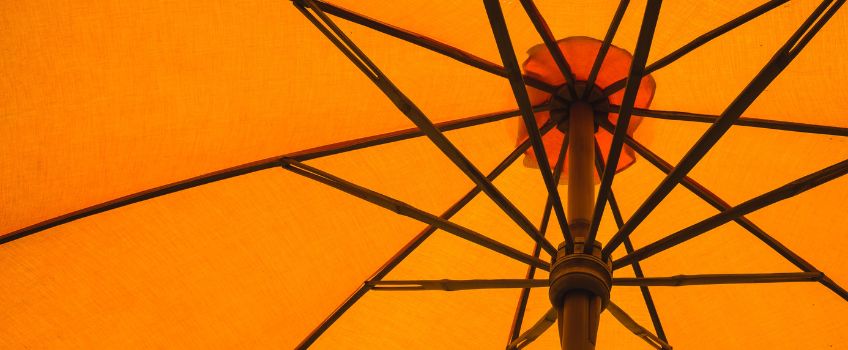 Underside of an orange umbrella