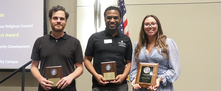 Steven Kalman, associate professor of Chemistry, Marques Johnson, associate dean of students, and student Ariel Graziano were recipients of awards at this year's Student, Faculty and Staff Dinner on Nov. 16.