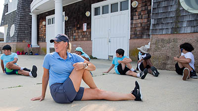 youth rowing stretching