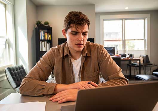 Student on computer taking virtual classes
