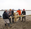 Image of Stockton University Students assisting to erect osprey platform in Atlantic City, NJ