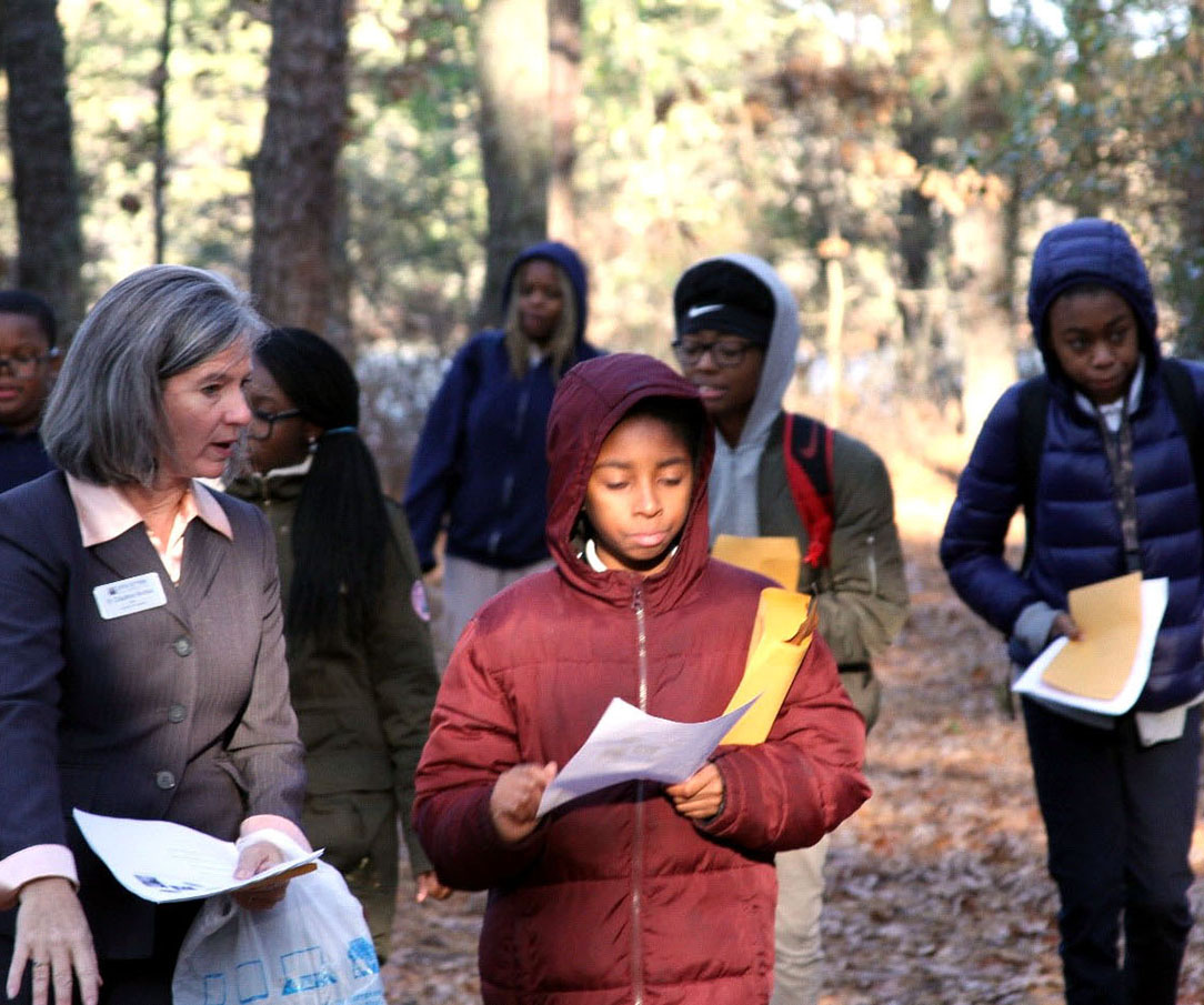 Image of local elementary school students on nature scavenger hunt