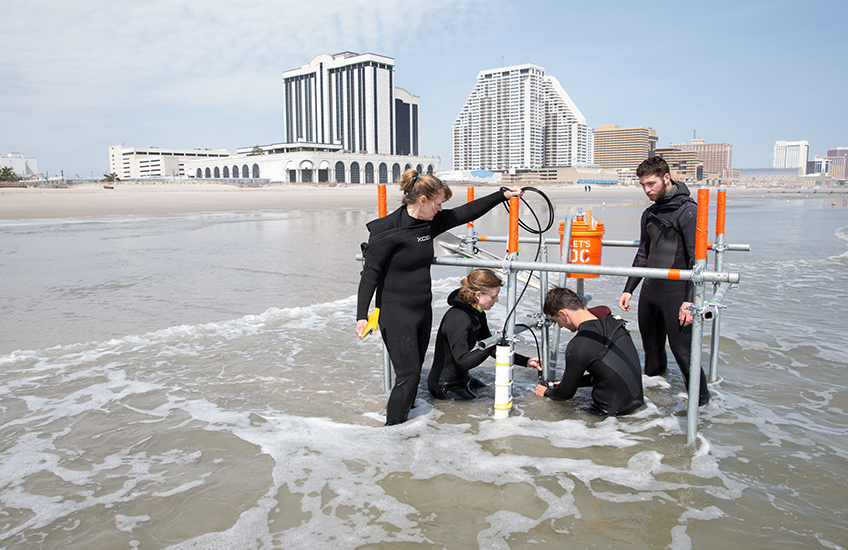 Researchers in the water conducting impacts to coast