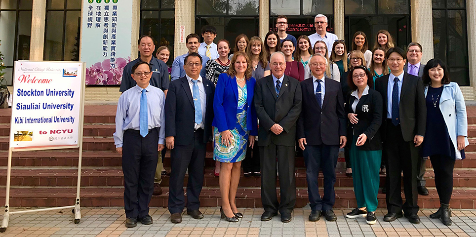 Stockton University President Harvey Kesselman and National Chiayi University President Chyung Ay, (front center) with representatives of Stockton and NCYU at NCYU. BELOW: Stockton University President Harvey Kesselman, left, and Andy Cheu-An Bi, director general of the Department of International and Cross-Strait Education at the Taiwan Ministry of Education. 