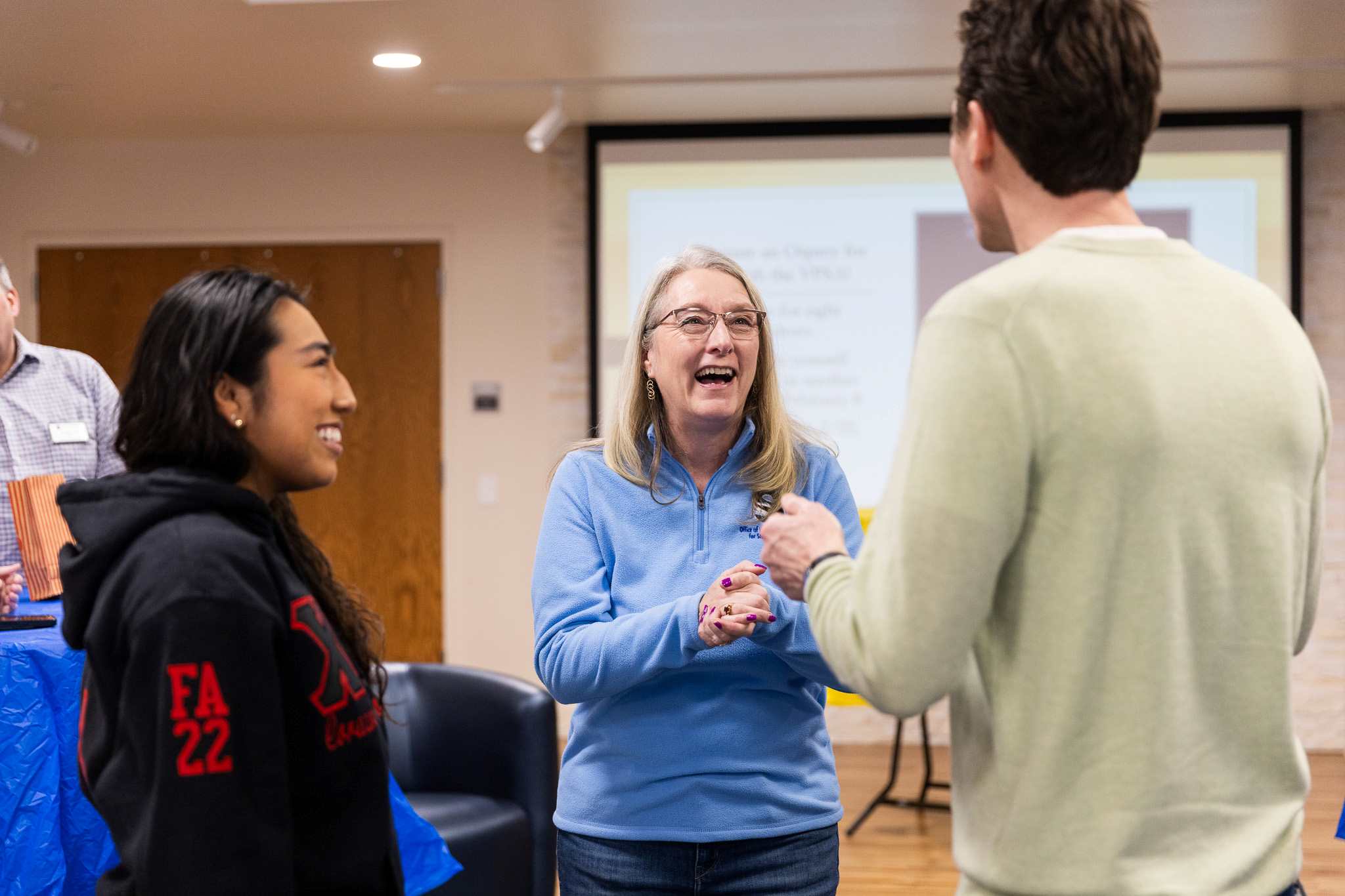 Vice President of Student Affairs Dr. Martha 'Marty' Wygmans, center, chats with students and faculty