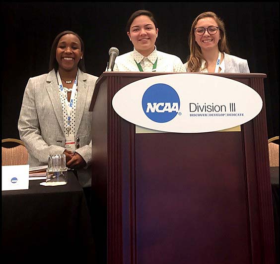 three women at podium