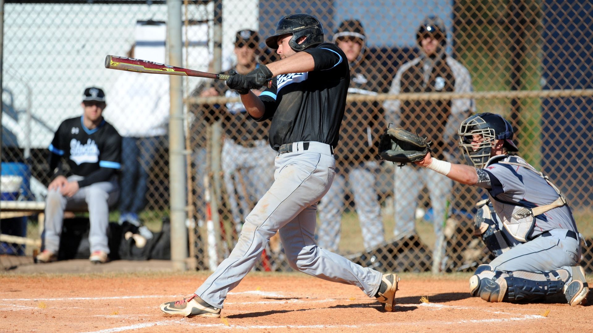 baseball player swinging bat