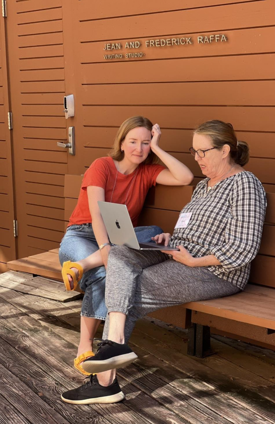 Nancy Reddy teaches a participant at writing getaway.