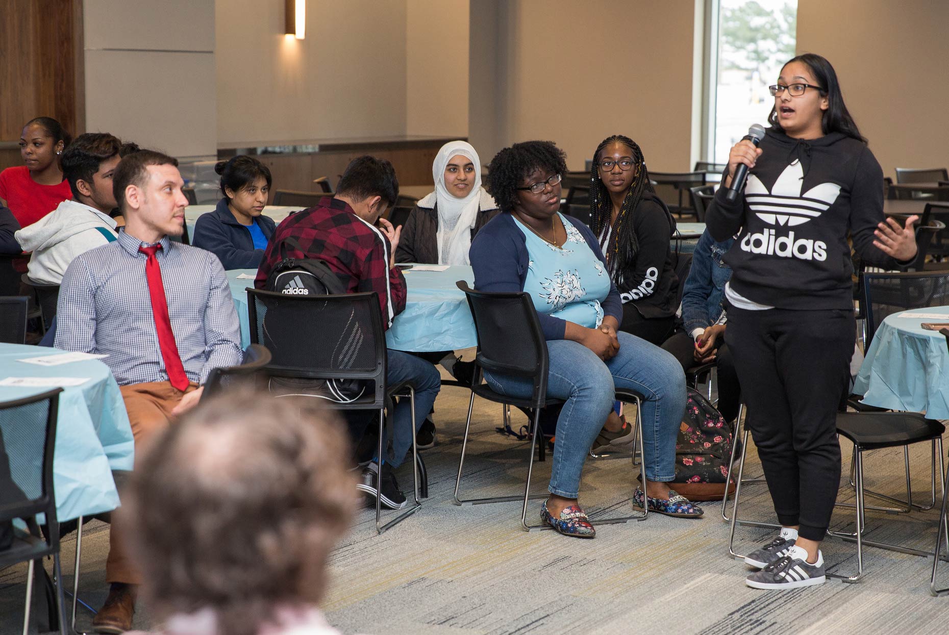 student talking on microphone 