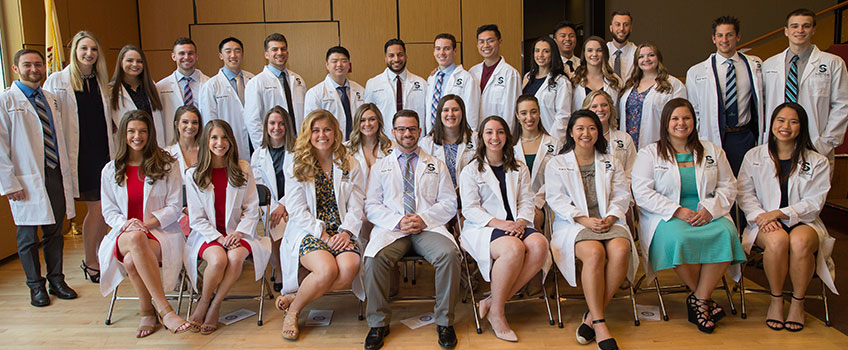 DPT students with their white coats 