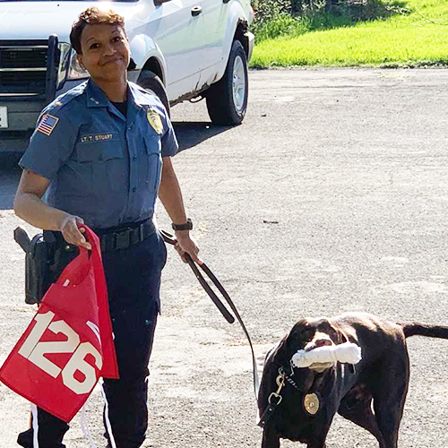 Hemi the chocolate lab, and his handler, Lieutenant Tracy Stuart