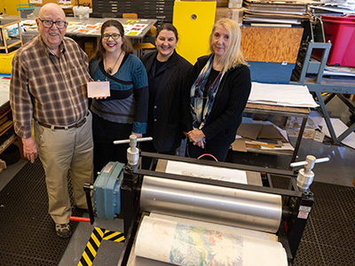 Gene Sullivan, his daughter Dawn DeZan, familiy friend Diane Tomash and Associate Professor of Art Mariana Smith 