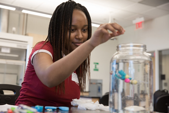 girl working on STEM activity