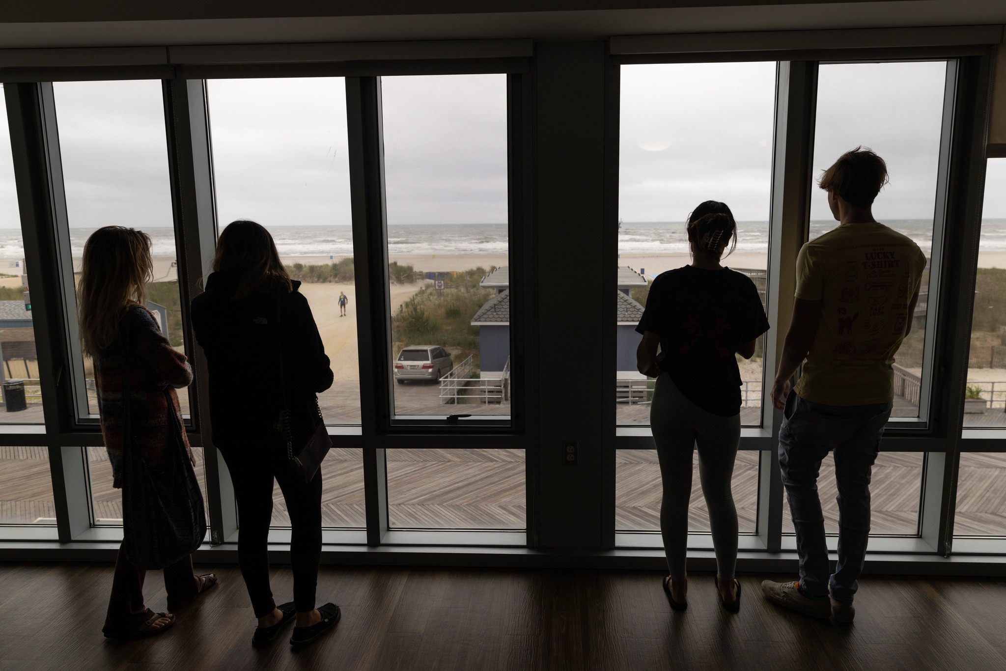 students stairing out of window at ocean