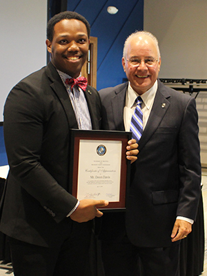 Student Trustee Deon Davis with President Kesselman