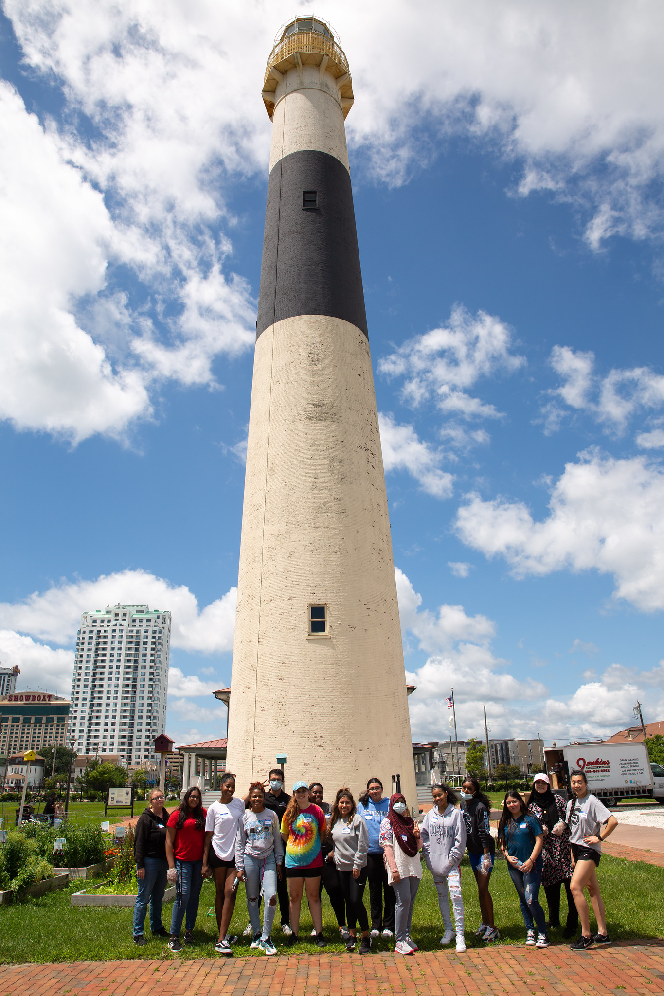 People standing in front of lighthouse