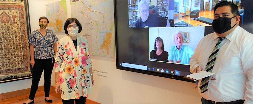 Holocaust Center Executive Director Gail Rosenthal (In floral jacket) with staff members Morgan Everman and Irvin Rodriguez-Moreno, do a Zoom interview with Associate Professor of History Michael Hayse and Holocaust survivor Elizabeth Roth from Vineland and her daughter-in-law Barbara Roth, whose parents were also survivors.