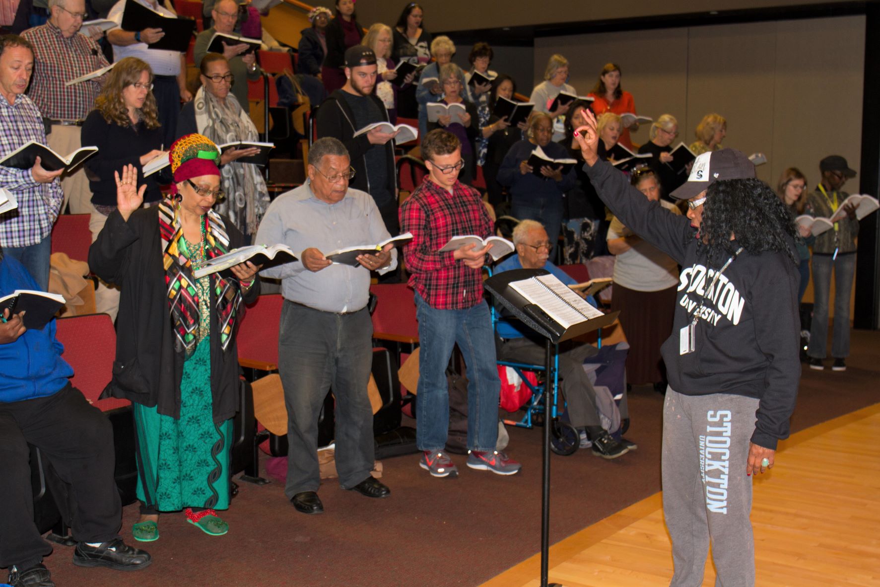 Beverly Vaughn instructing choir singers