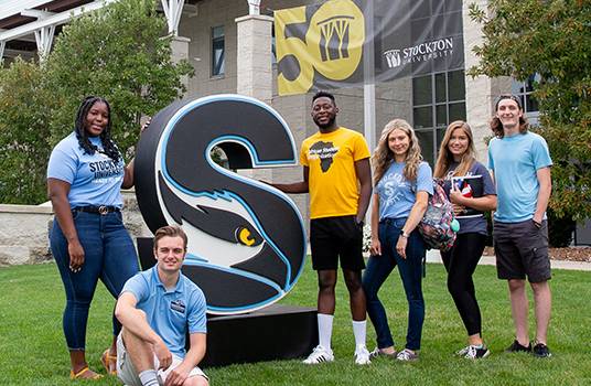 students with stockton s sculpture