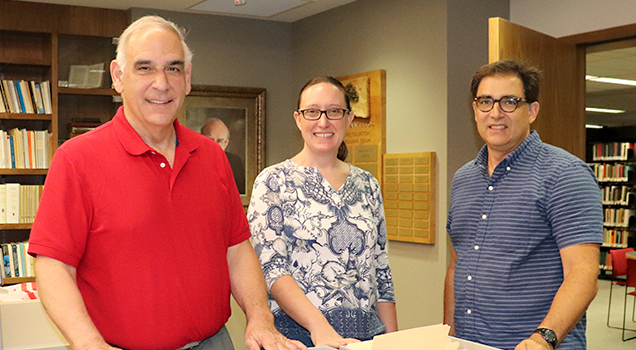 From left to right, visiting archivist William Samonides; Heather Perez, special collections librarian and University Archivist; and Tom Papademetriou, professor of History and director of Hellenic Studies.