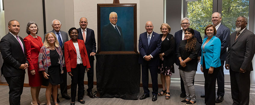 Members of the Board of Trustees celebrate President Harvey Kesselman