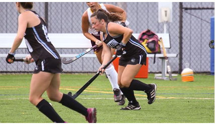 women's field hockey team playing