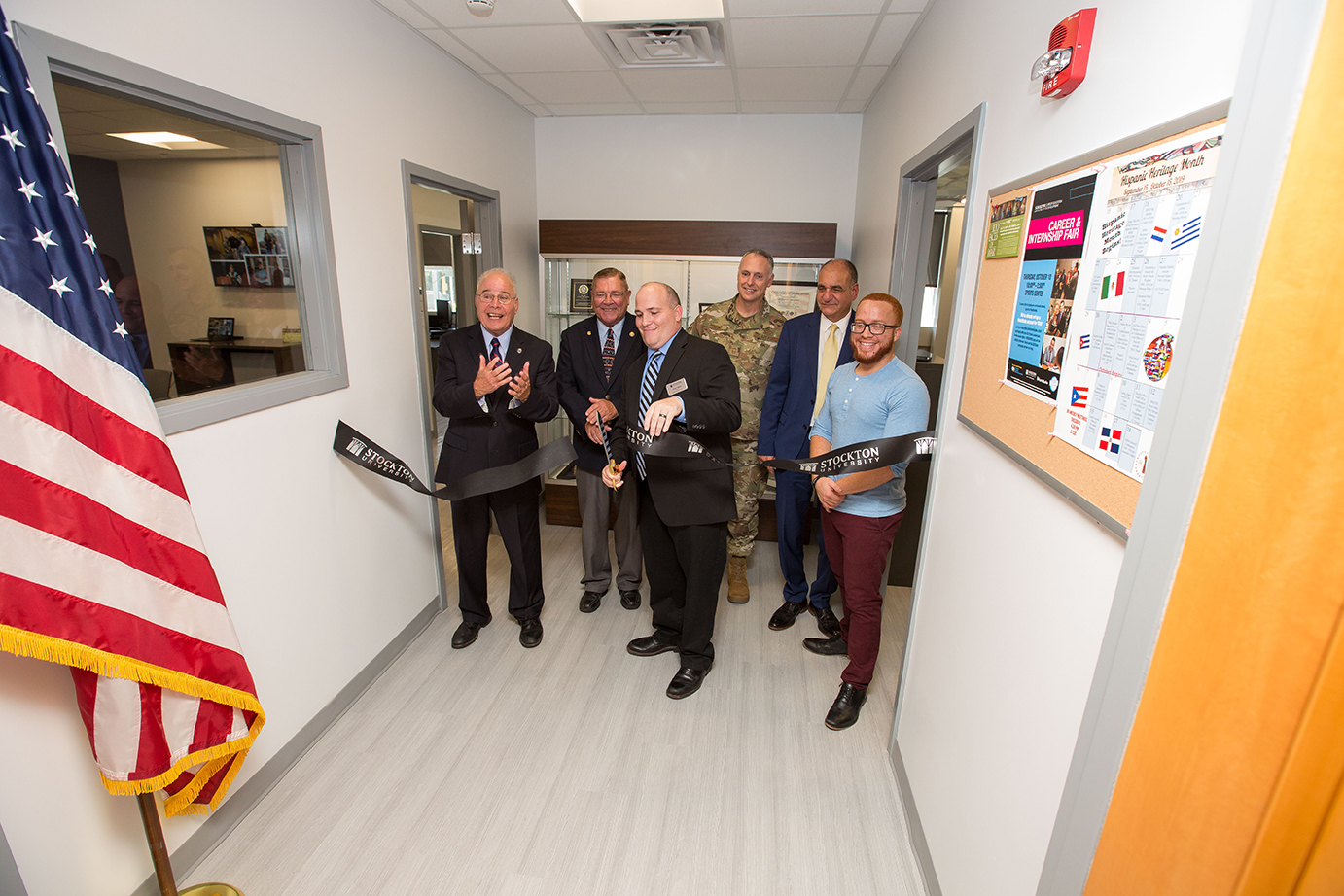 Director of the Office of Military and Veteran Services Jason Babin cuts the ribbon to formally open the new, larger office and lounge