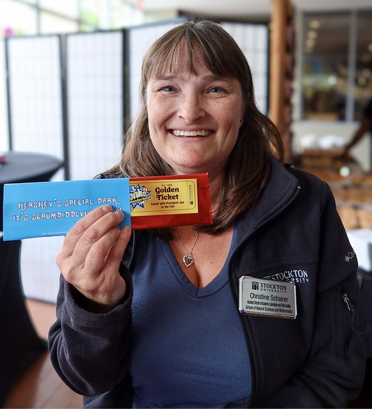 woman holding golden ticket