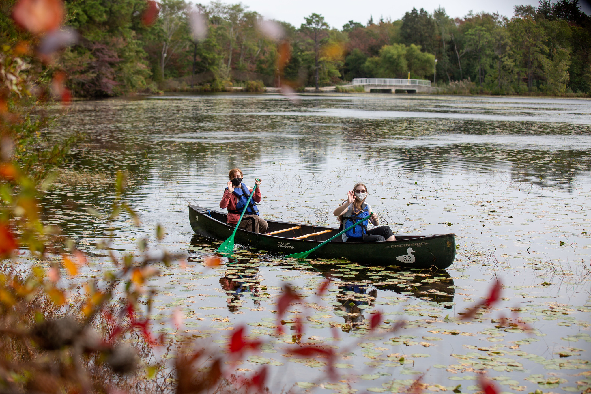 two people canoeing