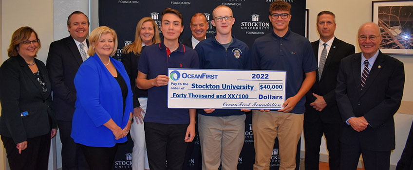 Representatives of OceanFirst Bank presented a check for student scholarships to Stockton University