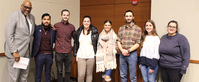 Assistant Vice President Stephen Davis with seven of the eight students who received Fellowships for Distinguished Students.