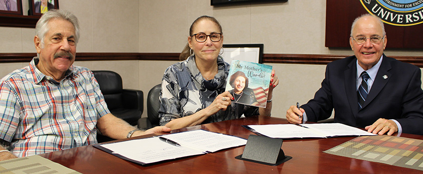 Stuart and Rita Fassler Stromfeld sign copywright agreement with President Harvey Kesselman for book 