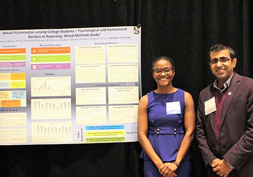 Rosheka Faulkner and Manish Madan, associate professor of Criminal Justice, with their research.