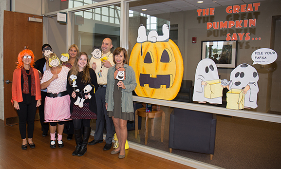 group of men and women dressed up in Charlie Brown characters 